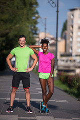 Image showing portrait of young multietnic jogging couple ready to run