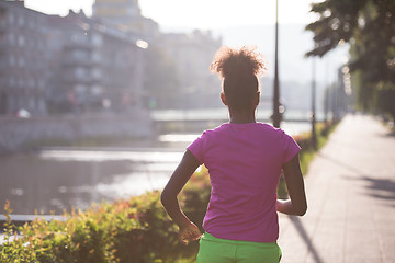 Image showing african american woman jogging in the city