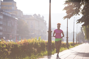 Image showing african american woman jogging in the city