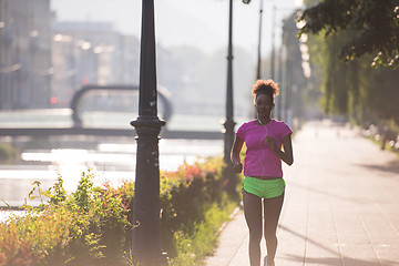 Image showing african american woman jogging in the city