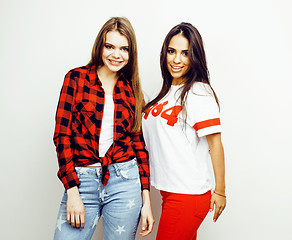 Image showing best friends teenage girls together having fun, posing emotional on white background, besties happy smiling, lifestyle people concept, blond and brunette multi nations