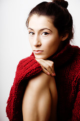 Image showing young pretty woman in sweater and scarf all over her face, lifes