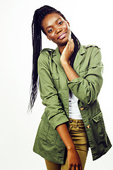 Image showing young pretty african-american girl posing cheerful emotional on white background isolated, lifestyle people concept