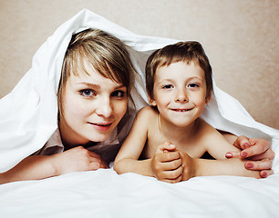 Image showing young blond woman with little boy in bed, mother and son, happy familyyoung blond woman with little boy in bed, mother and son, happy family