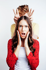 Image showing young attractive couple together having fun happy smiling isolated on white background, emotional posing, lifestyle people concept