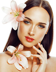 Image showing young attractive lady close up with hands on face isolated flowe