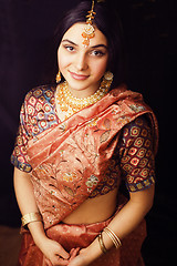 Image showing beauty sweet real indian girl in sari smiling on black backgroun