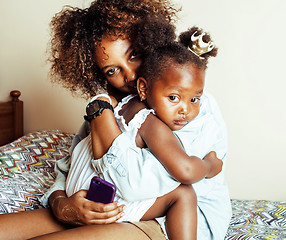 Image showing adorable sweet young afro-american mother with cute little daugh