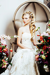 Image showing beauty young bride alone in luxury vintage interior with a lot o