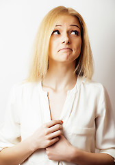 Image showing young blond woman on white backgroung gesture thumbs up, isolate