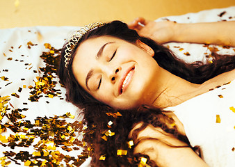 Image showing beauty young girl in gold confetti and tiara, little princess celebration hpliday, lifestyle people concept