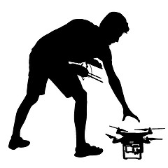 Image showing Black silhouette of a man operates unmanned quadcopter illustration