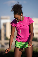 Image showing young african american woman running outdoors