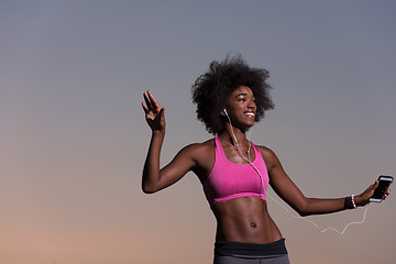 Image showing young black girl dances outdoors