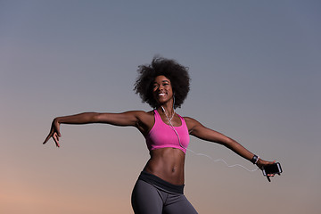 Image showing young black girl dances outdoors