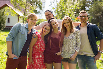 Image showing happy teenage friends hugging at summer garden