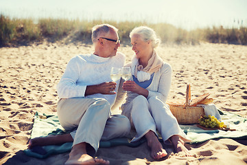 Image showing happy senior couple talking on summer beach