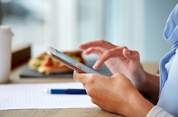 Image showing woman with smartphone and food at cafe