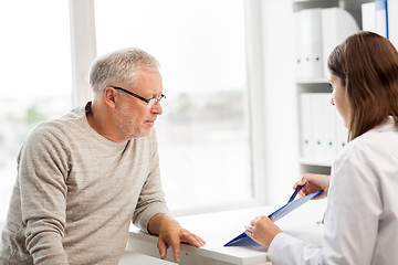 Image showing senior man and doctor meeting at hospital