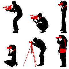 Image showing Set cameraman with video camera. Silhouettes on white background. illustration
