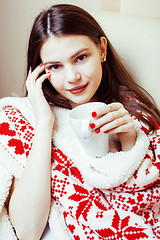 Image showing young pretty brunette girl in Christmas ornament blanket getting warm on cold winter, freshness beauty concept, lifestyle people