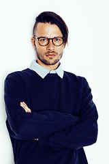 Image showing handsome middle age hipster man with modern hairstyle and tattoo, beard, close up on white background