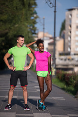 Image showing portrait of young multietnic jogging couple ready to run