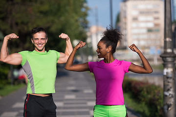 Image showing portrait of young multietnic jogging couple ready to run