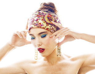 Image showing young pretty modern girl with bright shawl on head emotional posing isolated on white background, asian people ethnicity