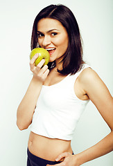 Image showing portrait of sporty young woman with green apple isolated on white background