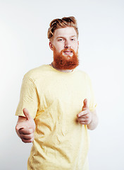 Image showing young handsome hipster ginger bearded guy looking brutal isolated on white background, lifestyle people concept