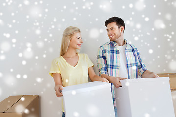 Image showing smiling couple with big boxes moving to new home