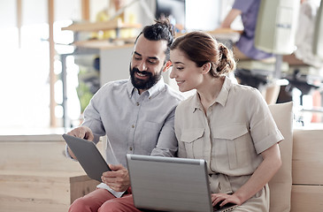 Image showing creative team with tablet pc and laptop in office