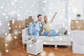 Image showing couple with boxes moving to new home and dreaming