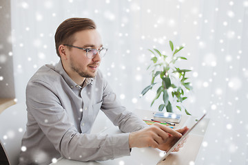 Image showing happy creative male office worker with tablet pc