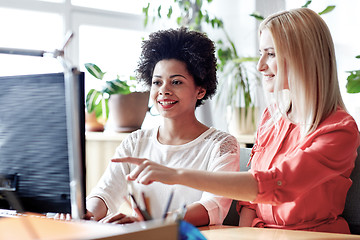 Image showing happy women or students with computer in office