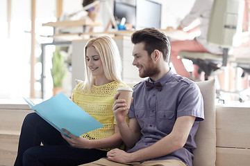 Image showing office workers with folder and coffee