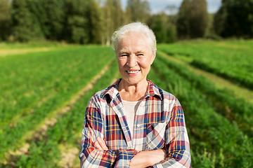 Image showing happy senior woman at farm