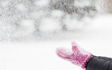 Image showing close up of woman throwing snow outdoors