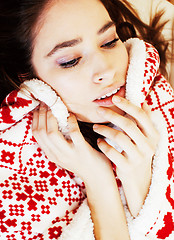 Image showing young pretty brunette girl in Christmas ornament blanket getting