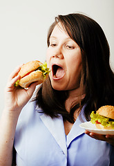 Image showing fat white woman having choice between hamburger and salad close 