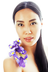 Image showing young pretty asian woman with flower orchid close up isolated sp