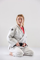 Image showing The female judokas fighter posing on gray