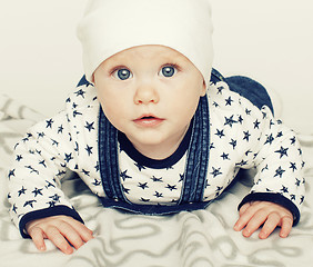 Image showing little cute baby toddler on carpet isolated close up smiling ado