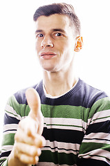 Image showing Portrait of a smart serious young man standing against white bac