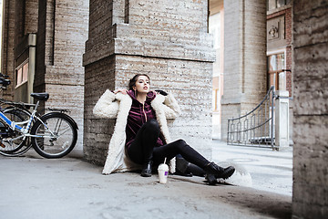 Image showing young pretty stylish teenage girl outside on city street fancy f