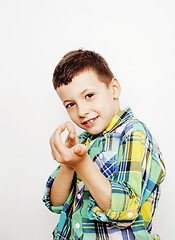 Image showing young pretty little boy kid wondering, posing emotional face isolated on white background, gesture happy smiling close up, lifestyle people concept