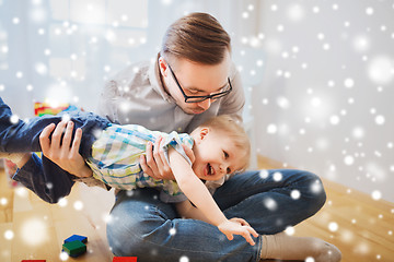 Image showing father with son playing and having fun at home