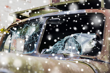 Image showing war truck with broken windshield glass over snow