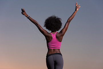 Image showing young black girl dances outdoors